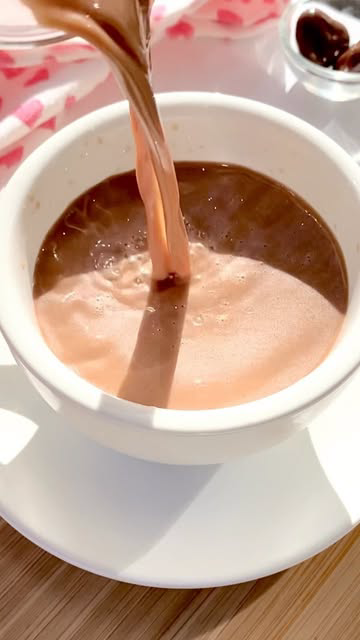 Warm milk + a few of your favorite chocolates = the best hot chocolate :) 

** I used @traderjoes dark chocolate caramel hearts 

#hotchocolatebomb #cutecup #hotcocoarecipe #valentinesdrinks #valentinesdaytreats #heartshapedcandy #valentinesdessert #